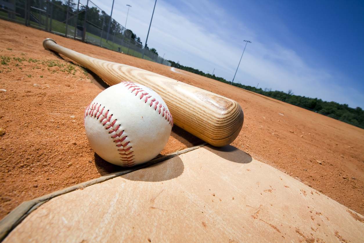Baseball and Bat on Home Plate